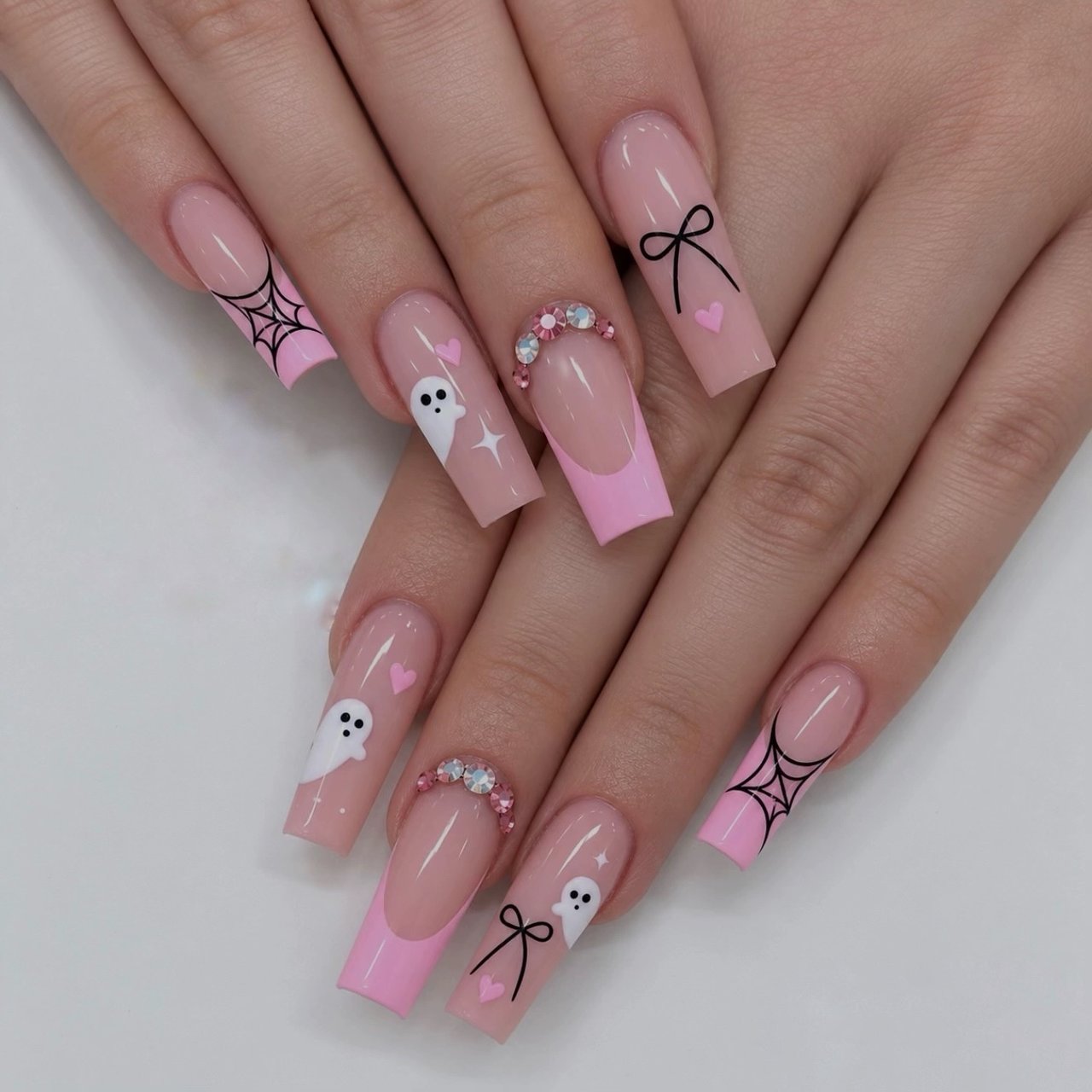 Pink Halloween nails with ghosts