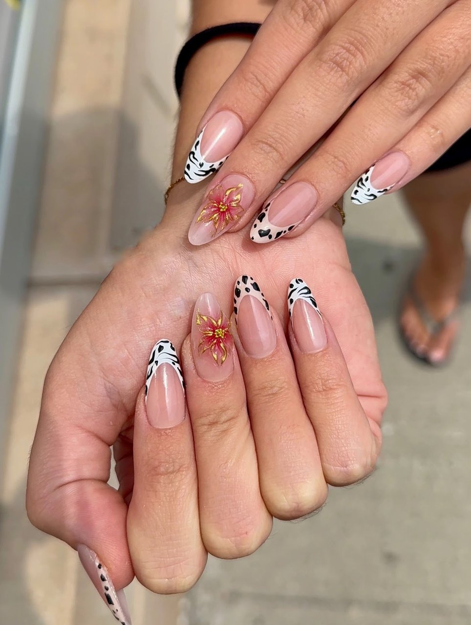Almond nails with cow print & red flower