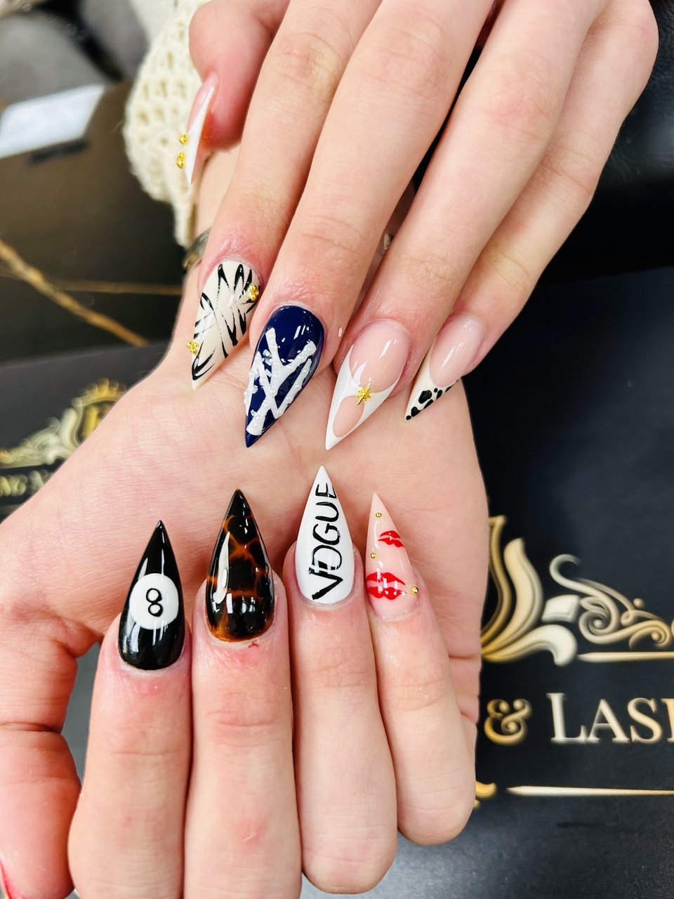 Stiletto nail art with Vogue motif