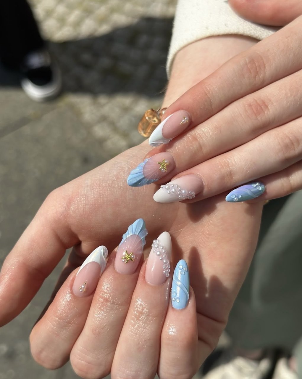 Light blue almond nails with pearls